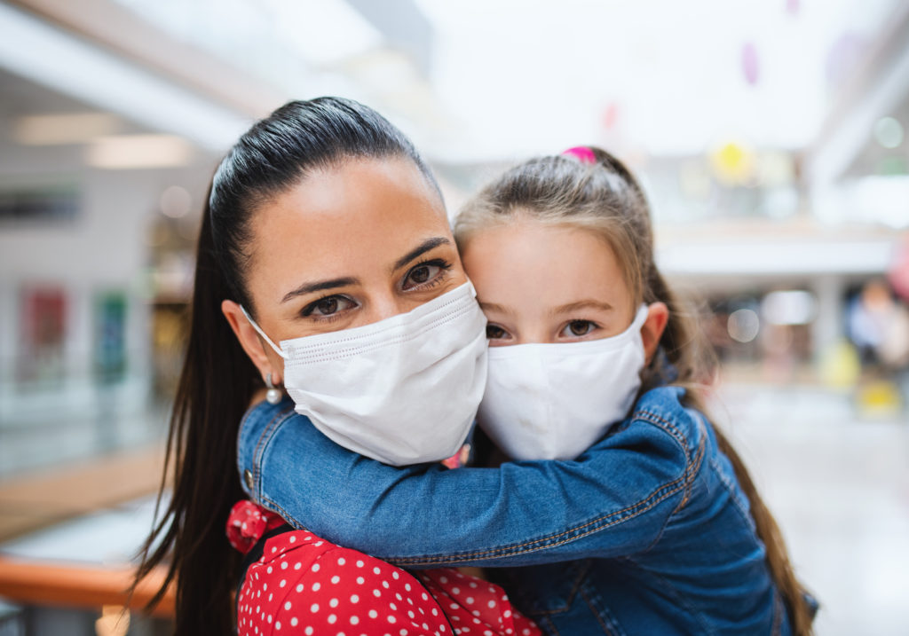 immigrant-mother-and-daughter-with-coronavirus-masks